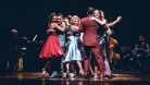 A group of tango dancers on stage.  © Paola Evelina
