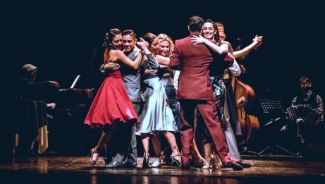 A group of tango dancers on stage. 
