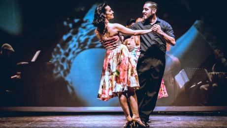 A group of tango dancers on stage. 
