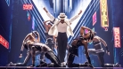 MJ stands center, arms up, in his iconic white suit. He and several dancers perform Smooth Criminal. © Matthew Murphy,
MurphyMade