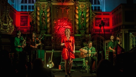 Breabach performing on stage in a church