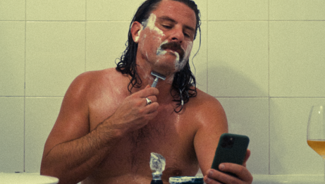 Unessential Oils in the bath shaving his mustache