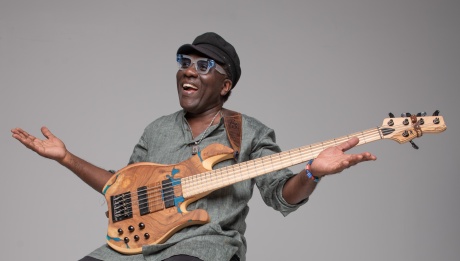 Richard Bona smiling with his guitar.