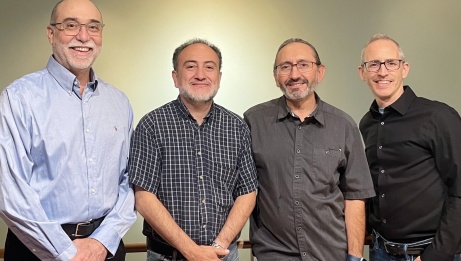 The four members of Carlos Alberto Santana Jazz Quartet standing and smiling.