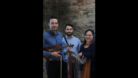 The 3 members of Masters in the Hall with their instruments, smiling.